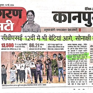 Hindi newspaper front page with a photo of a woman at the top and a group of people raising their hands in celebration beneath the main headlines.