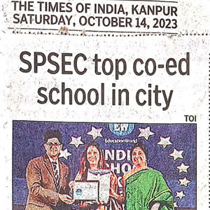 Newspaper clipping with headline 'SPSEC top co-ed school in city' showing three people presenting a certificate at an awards ceremony.