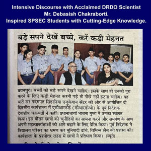 Newspaper clipping on a blue border showing a group photo of students and scientists posing together; headline mentions an intensive discourse with a DRDO scientist and inspired SPSEC students, with Hindi text below.