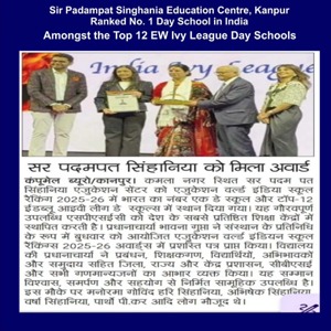 Group of people on a stage receiving an award plaque at a school awards ceremony, with a blue banner backdrop and a newspaper clipping below.