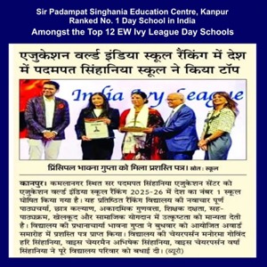 Award ceremony on stage: a man hands a framed certificate to a woman while others look on, with a banner reading 'India day schools' in the background.