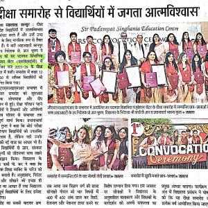 Group of students in red gowns holding certificates on stage during a school convocation ceremony.
