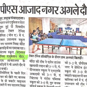 Newspaper photo showing people playing table tennis in an indoor hall during a local tournament.