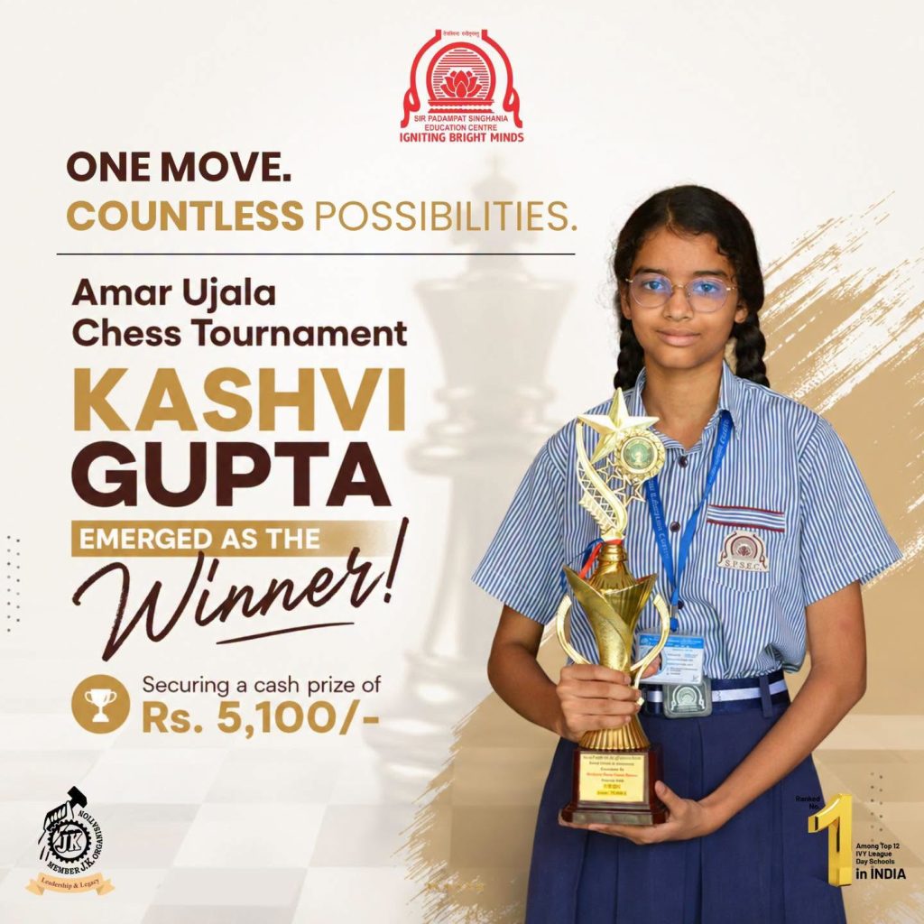 One Move Countless Possibilities Kashvi Gupta Emerges Winner Young schoolgirl in a striped uniform holding a trophy stands on a promotional poster for the Amar Ujala Chess Tournament, featuring Kashvi Gupta as the winner.