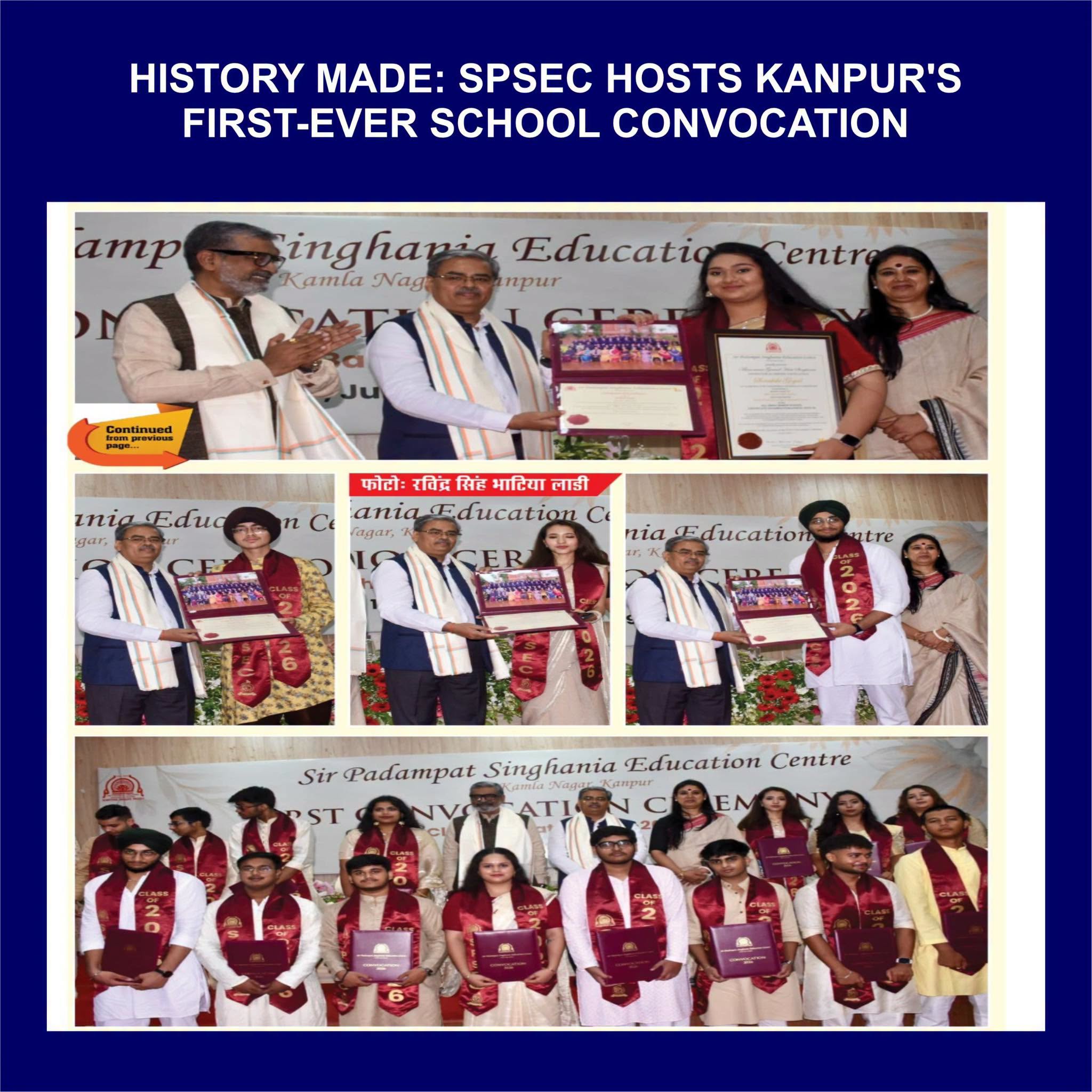 Group of graduates in white outfits with maroon sashes holding diplomas on stage at a convocation ceremony